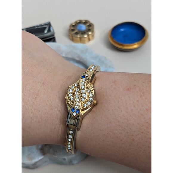 Vintage R Miller Gold Tone Bangle Peek a boo Watch with Snake Rhinestones - Picture 1 of 9